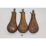 THREE BRASS & COPPER POWDER FLASKS. A decorative Powder Flask with James Dixon and Sons on the