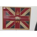 A FRAMED REGIMENTAL FLAG. Set in a partial Union Jack the Kings Crown above a Charging Boar, with X1