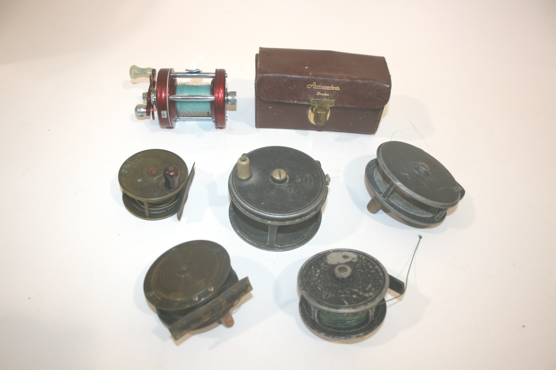 FISHING REELS & ACCESSORIES including a Eaton & Deller 3 1/2" reel, two small brass reels with