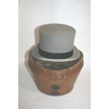 LEATHER CASED TOP HAT a Grey Top Hat by A J White, Jermyn St, London. In a fitted leather case.