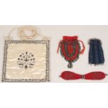 AN C18TH MISERS PURSE A misers purse dating to the late 1700's, with metal beadwork and bells at