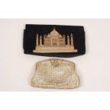 A DIAMANTE EVENING BAG Heavy with diamantes laced together over a cream satin liner. Clasped with