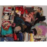 A COLLECTION OF HABERDASHERY AND MILLINERY ITEMS A quantity of feathers, ribbons and a roll of