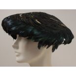 A 1950'S FEATHER HAT Irridescant black and blue feathers (Austrolaupe) on a flying saucer hat. Inner