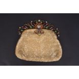 A BUTLER AND WILSON BEADED BAG From the 1970's this evening bag has been covered in sparkling mother