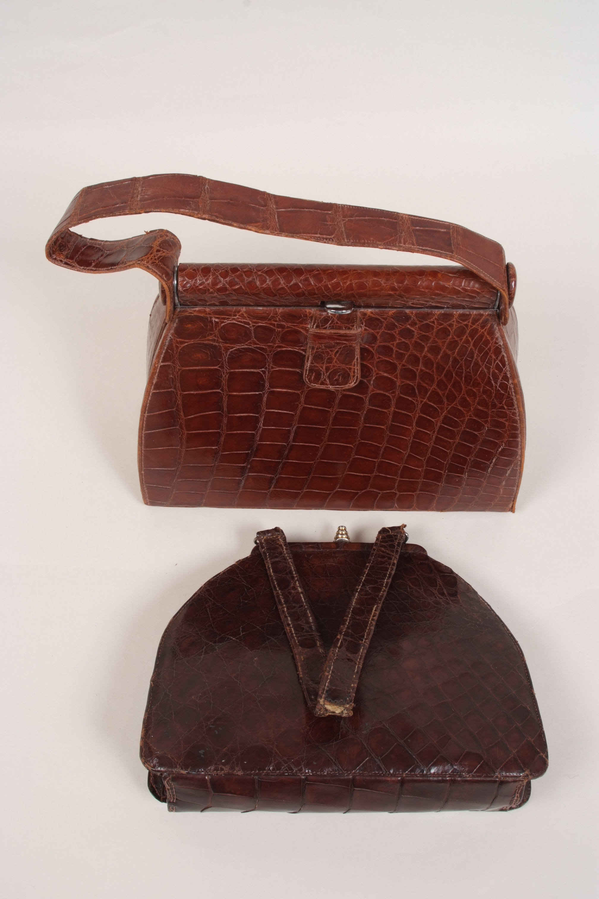 TWO VINTAGE CROCODILE HANDBAGS A 1950's lighter brown crocodile handbag with inner zipped pocket.