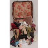 A COLLECTION OF VINTAGE HABERDASHERY A suitcase of trims and braids. (qnty)