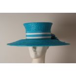 A TURQUOISE 'HARDY AMIES' STRAW HAT In it's original hat box, a very smart straw hat with a