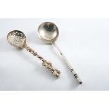 A VICTORIAN SUGAR SIFTER LADLE with a cast, naturalistic stem, maker's mark mis-struck "SW"?, London