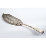 SOUTH AFRICA:- An early 19th century Fiddle pattern fish slice with a border engraved, slot-