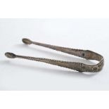 A PAIR OF GEORGE III FEATHER-EDGE SUGAR TONGS with chased decoration on the bowls and u-section,