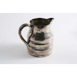 AN EDWARDIAN SMALL JUG with concave bands around the lower body & a scroll handle, by G. Nathan & R.