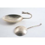 A HAND-MADE SPOON with a circular hammered bowl and an "eye" terminal by Amy Sandheim, London 1936