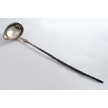 A GEORGE IV WEST COUNTRY PUNCH LADLE with a whalebone handle and on oval bowl with a pouring lip, by