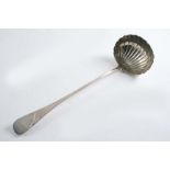 A GEORGE III OLD ENGLISH PATTERN SOUP LADLE with a fluted bowl, by William Eaton, London 1806; 13.5"