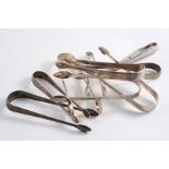 SEVEN VARIOUS PAIRS OF GEORGE III SUGAR TONGS a Victorian pair and a Chinese pair, some