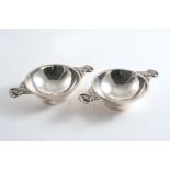 BY BERNARD INSTONE:- A pair of 20th century small. quaiches with cast & pierced "thistle" handles