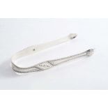 PETER & JONATHAN BATEMAN:- A pair of sugar tongs with bright-cut engraved decoration & initials