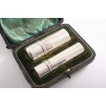 AN EDWARDIAN TRAVELLING SHAVING SET in a fitted case, including a tubular soap holder and a