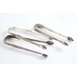 A PAIR OF GEORGE III ENGRAVED SUGAR TONGS with the Prince of Wales's feathers on each side,