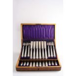 A LATE VICTORIAN CASED SET OF TWELVE PAIRS OF FISH KNIVES & FORKS, the handles decorated with