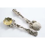 EN SUITE:- A pair of mid 19th century cast salt spoons, decorated with putti picking grapes from a