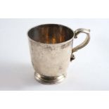 A SMALL VICTORIAN MUG of plain campana form with a circular foot and an s-scroll handle, (traces