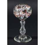 VICTORAIN GLASS PAPERWEIGHT, with end of day style decoration, on a hollow baluster stem and