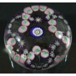 CLICHY GARLAND PAPERWEIGHT, a central blue cane inside intertwined purple and pink garlands,