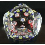 FACETED MILLEFIORI PAPERWEIGHT, probably St Louis, a central cane inside a ring of five canes and