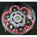 BACCARAT GARLAND PAPERWEIGHT, a central cluster of green and pink canes inside white and pink