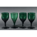 SIXTEEN GREEN WINE GLASSES, 19th century, with ogee bowls and spreading feet, height 13cm approx (