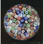BACCARAT MILLEFIORI PAPERWEIGHT, circa 1850, with closely packed canes including silhouettes of a