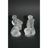 TWO LALIQUE FIGURES the frosted figures both holding animals in their arms.