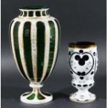 BOHEMIAN GLASS VASE, of shouldered form, white cut through to green with gilt highlights, height