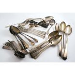 MISCELLANEOUS ANTIQUE FLATWARE:- Two basting spoons, a serving fork, sixteen table spoons (some