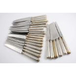 A SET OF TWELVE MODERN FEATHER-EDGE PATTERN TABLE KNIVES and twelve side knives to match with