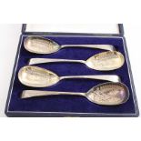 A CASED SET OF FOUR GEORGE III TABLE SPOONS now later decorated (as "berry" spoons) & hallmarked