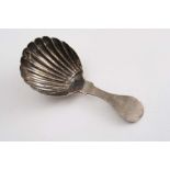 A SCOTTISH PROVINCIAL CADDY SPOON with a rounded terminal, shoulders and a fluted bowl, by Alexander