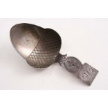 A GEORGE III ACORN CADDY SPOON with engraved detail & square terminal, initialled "U", by