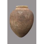 TERRACOTTA OLIVE JAR, with a band of pinched decoration to the shoulders, height 145cm, diameter