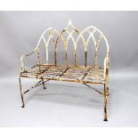 REGENCY STYLE IRON BENCH, with triple arched back, scrolling arms and slatted seat, height 117cm