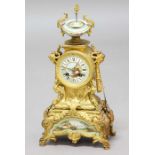 FRENCH GILT METAL AND PORCELAIN MOUNTED MANTEL CLOCK, the 3 1/2" painted dial on a brass eight day
