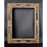 A PICTURE FRAME 19/20th Century, in Spanish Baroque style, carved wood, with gilt leafy scroll