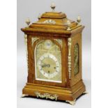 OAK BRACKET CLOCK, the 6 1/2" silvered chapter ring on a brass dial with star burst arch, on a
