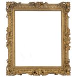 A CARVED WOOD GILDED PICTURE FRAME English, 18th Century, carved with pierced scrolls, rippled