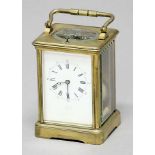 BRASS FOUR PANE CARRIAGE CLOCK, the enamelled dial with rubbed inscription, on a brass eight day
