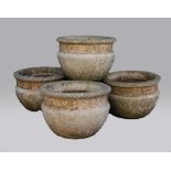 SET OF FOUR RECONSTITUTED STONE PLANTERS, with a band of floral decoration, height 35cm, diameter