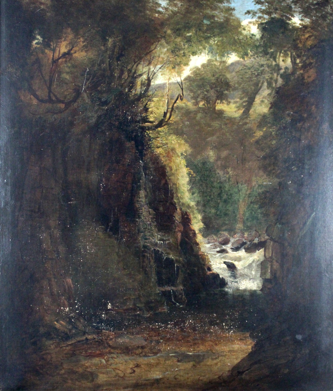 ATTRIBUTED TO FREDERICK RICHARD LEE, RA (1798-1879) A ROCKY WOODED GORGE Oil on canvas 79 x 67.