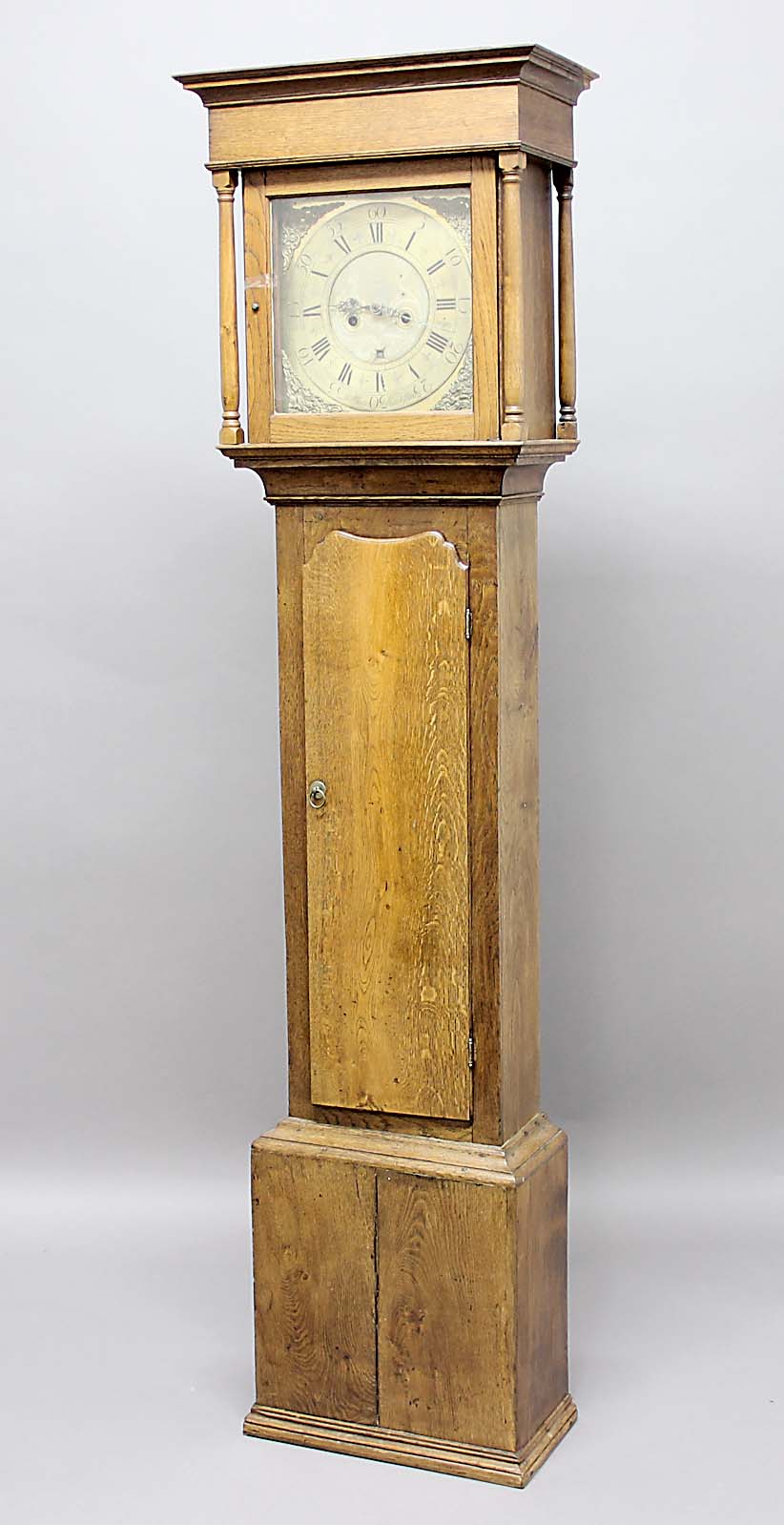 OAK LONGCASE CLOCK, the brass dial with 11 1/2" chapter ring and date aperture, inscribed Tho.